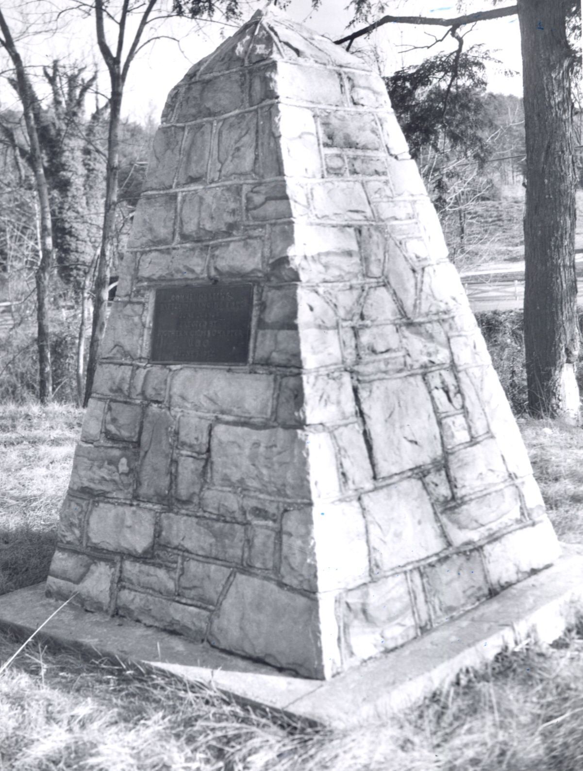 Hanging rock monument